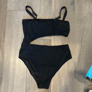 Black one piece with side cutout